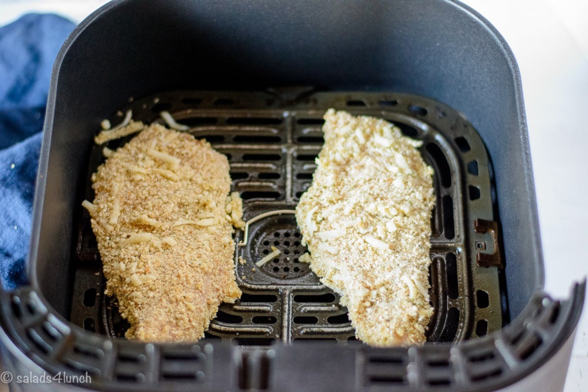 Air Fryer Chicken Parmesan 6 - Making this air fryer chicken parmesan is easy to do and takes half the time than it does in the conventional oven. Crispy and delicious! Garnish with parsley, serve with Easy Air Fryer Broccoli and enjoy!!