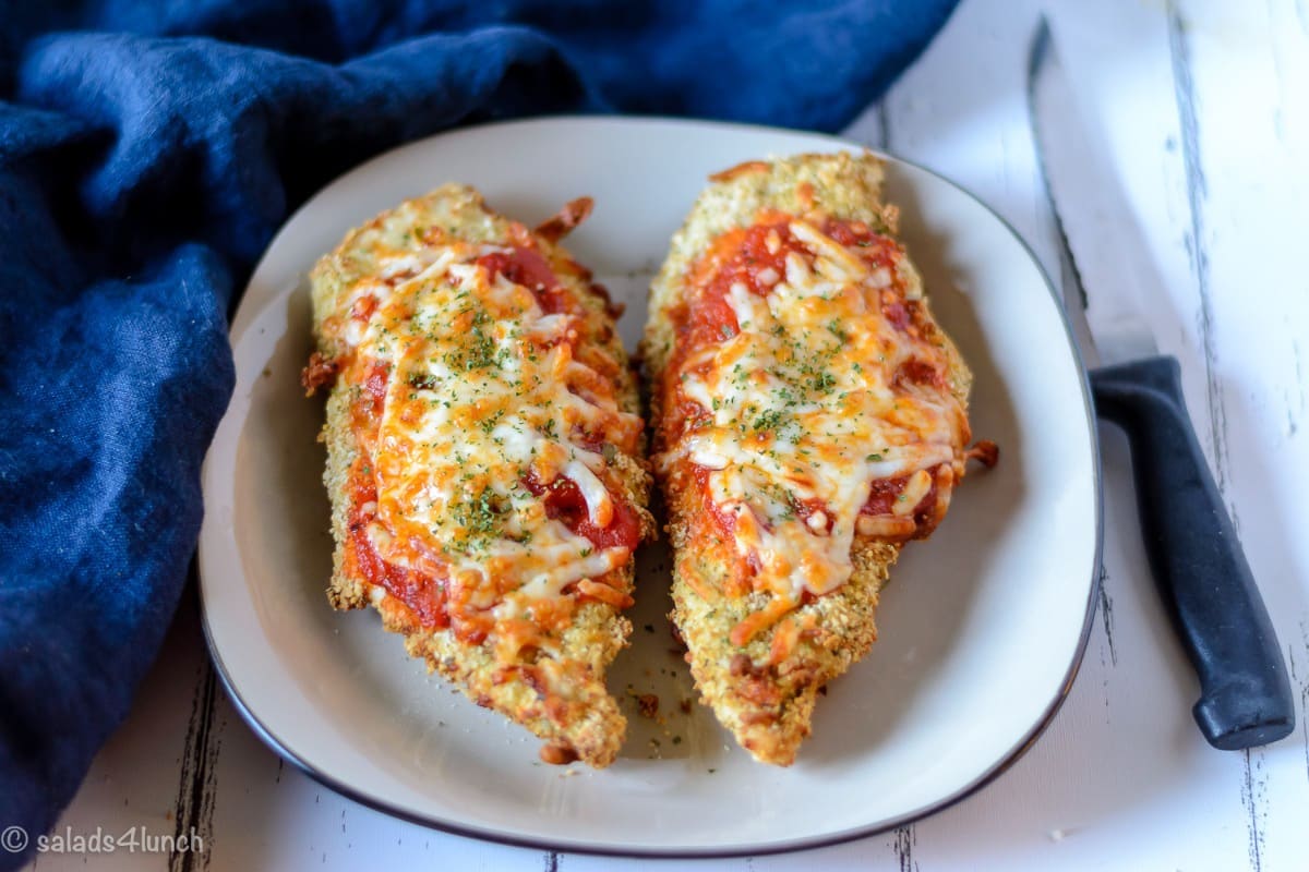 Air Fryer Chicken Parmesan 9 - Making this air fryer chicken parmesan is easy to do and takes half the time than it does in the conventional oven. Crispy and delicious! Garnish with parsley, serve with Easy Air Fryer Broccoli and enjoy!!