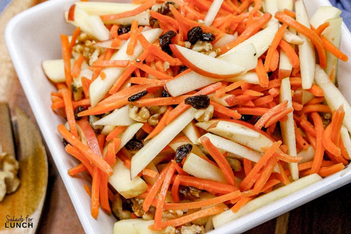Carrot Raisin Salad with Apples Recipe 17 - This fresh and simple carrot raisin salad combines crisp apples and crunchy carrots with a light, tangy dressing. It's a perfect vegetarian side dish for a light lunch or dinner, bringing together sweetness and a bit of zest.