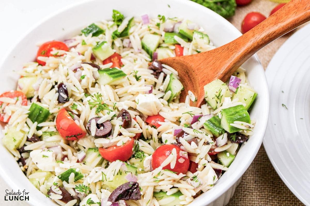 Greek Orzo Salad 17 - Are you ready to jazz up your lunchtime routine with a salad that's as delicious as it is easy to make? Say hello to the Greek Orzo Salad—a vibrant, refreshing dish that's bursting with Mediterranean flavors and perfect for any meal. Whether you're looking for a quick lunch or a light dinner, this salad is a crowd-pleaser that’s sure to satisfy. This Greek Orzo Salad comes together in just 25 minutes, making it an ideal choice for busy days when you still want to eat something healthy and delicious.