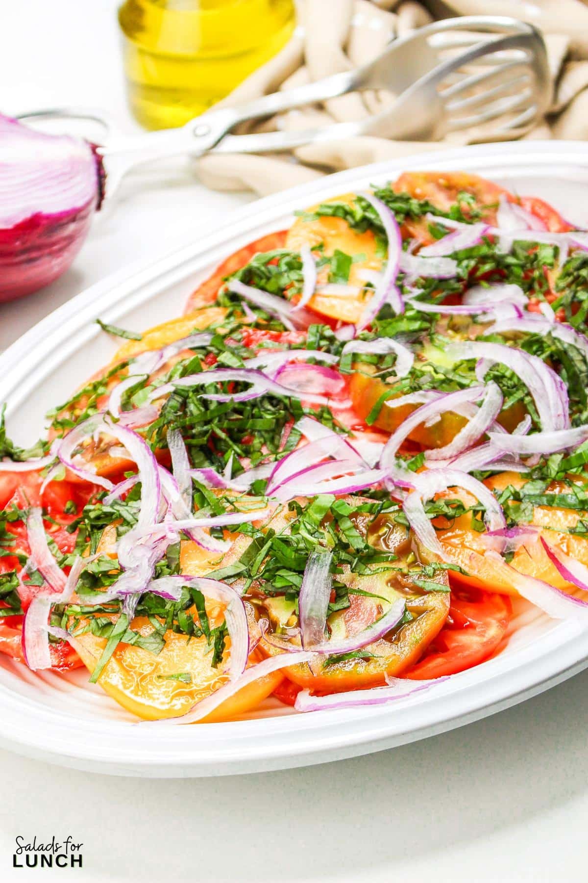 Heirloom Tomato Basil Salad Recipe 20 - This fresh and vibrant salad showcases the natural sweetness of heirloom tomatoes paired with the aromatic essence of basil. It's a perfect dish for a light lunch or as a side to complement your favorite summer meals.