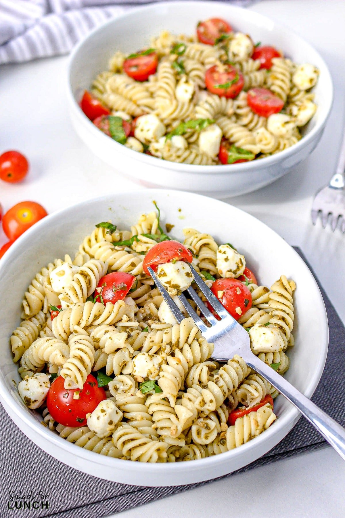 Pesto Caprese Pasta Salad 16 - This pasta salad is loaded with your favorite pasta noodles, fresh tomatoes and mozzarella and tossed in the best tasty pesto! It's such an easy dish and perfect for anytime of the year!