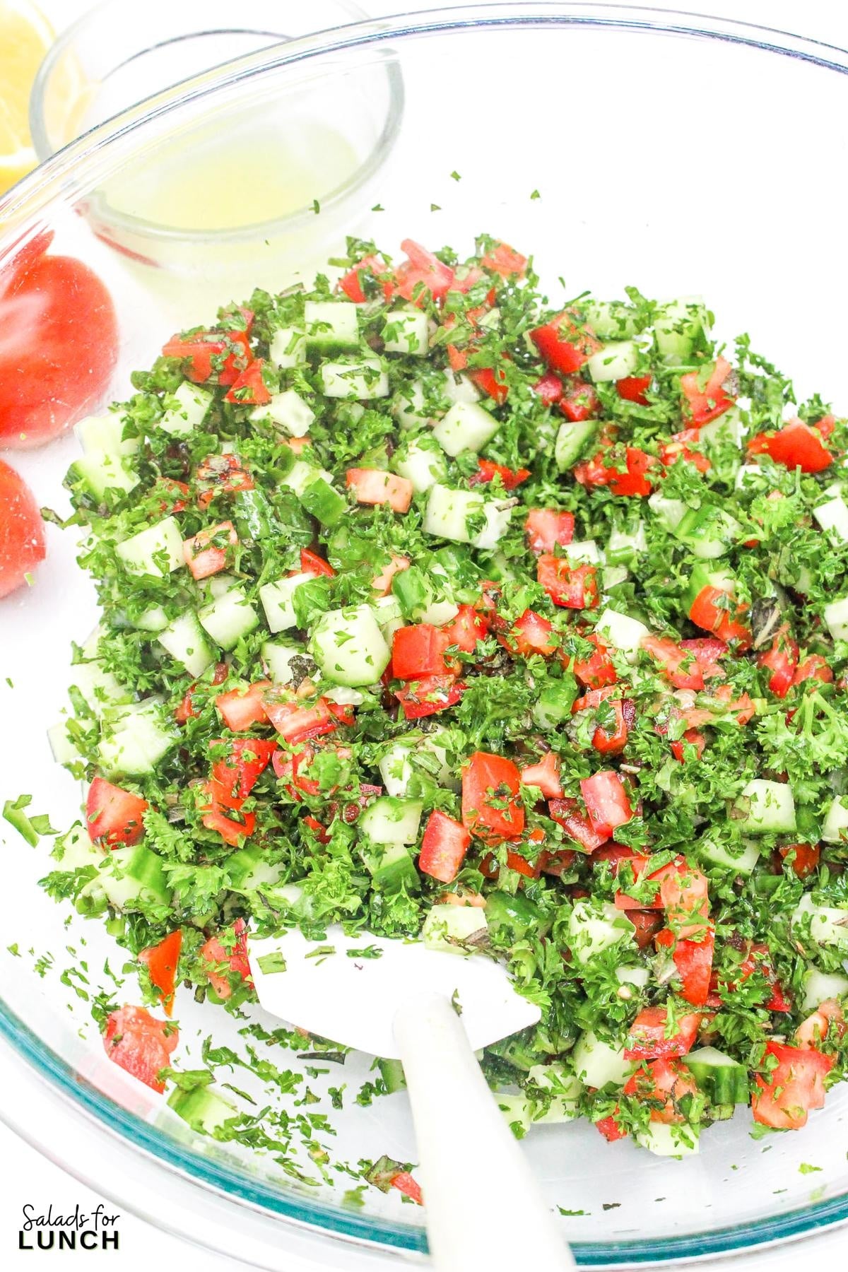 Tabbouleh Salad Recipe 7 - This refreshing Tabbouleh salad is made with bulgur wheat, fresh parsley, mint, tomatoes, and cucumbers, all tossed in a light lemon and olive oil dressing. It's a great option for a light meal or side dish.